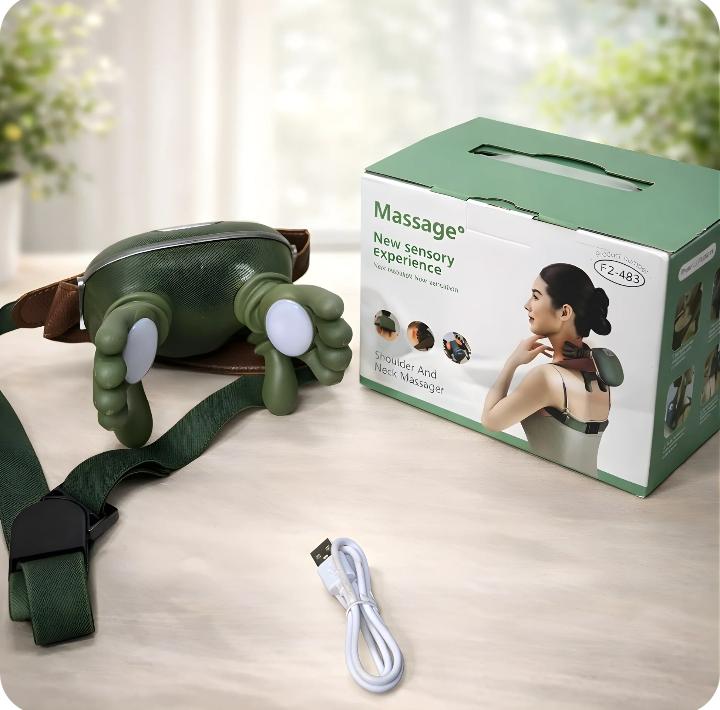 Green massage device with packaging, USB cable, and strap on a wooden surface.
