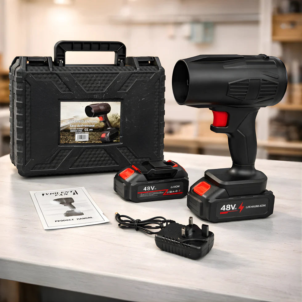 Black cordless drill set with case, batteries, and charger on a table.